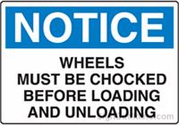 Notice Wheels Must Be Chocked Before Loading and Unloading